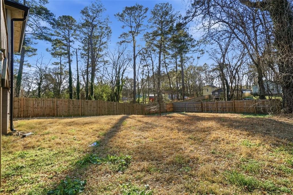 2281 Pryor Road Southwest Atlanta, GA 30315 - Photo 30 of 32 a backyard of a house with lots of green space