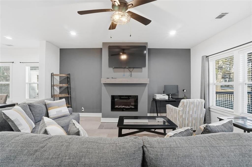 2281 Pryor Road Southwest Atlanta, GA 30315 - Photo 5 of 32 a living room with furniture and a fireplace