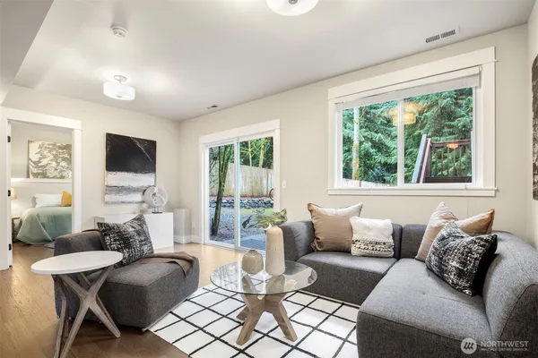 a living room with furniture and a large window