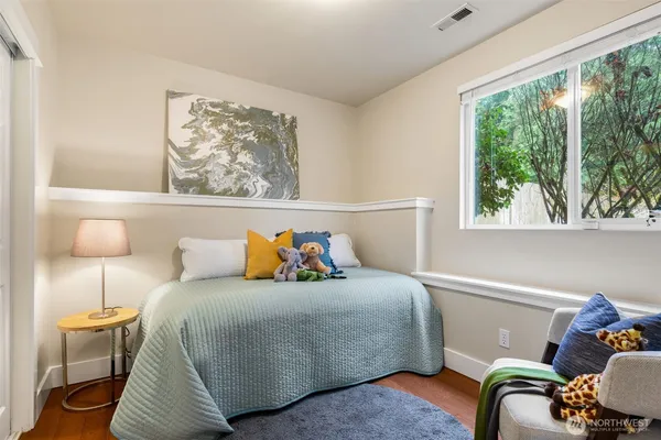 a bedroom with a bed and window