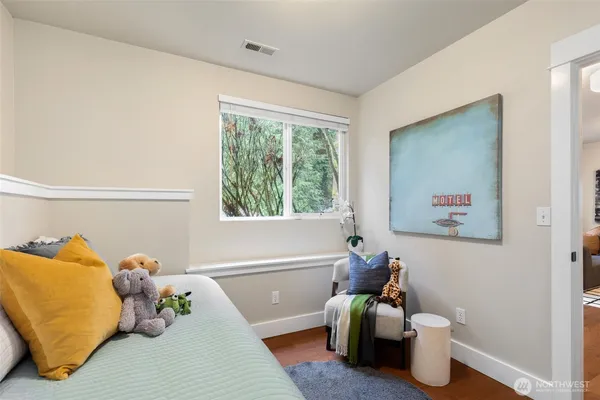 a bed room with a bed and a window