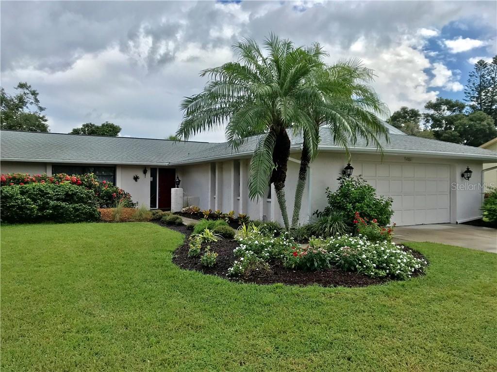 4761 Greencroft Road Sarasota, FL 34235 - Photo 1 of 1 a front view of a house with garden