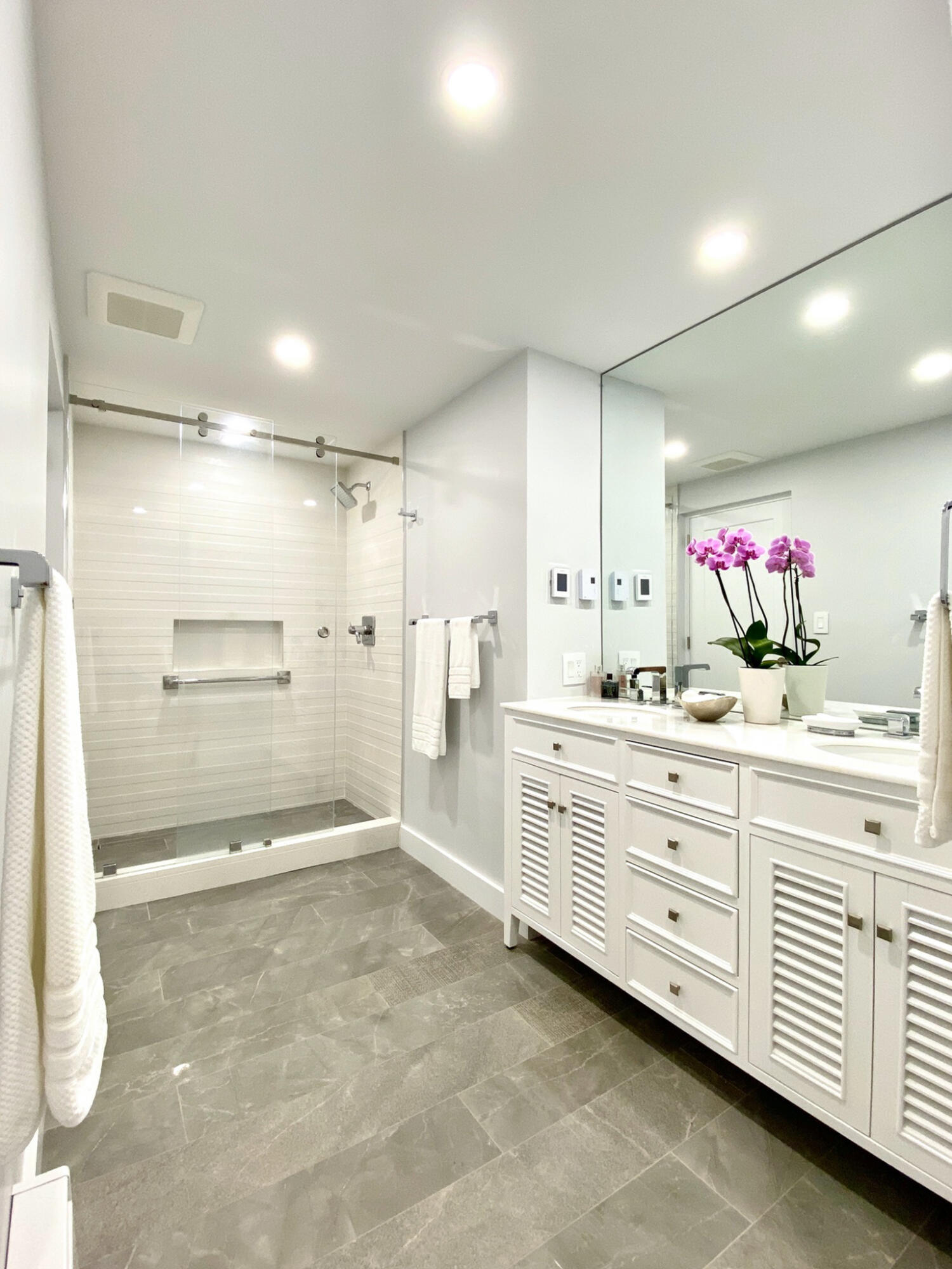 1 Belmont Road, Unit 225 West Harwich, MA 02671 - Photo 11 of 31 a bathroom with a double vanity sink mirror and shower