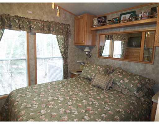 54 Bypass Road, Unit 106 Wells, ME 04090 - Photo 6 of 16 Master Bedroom. Windows overlook the...
