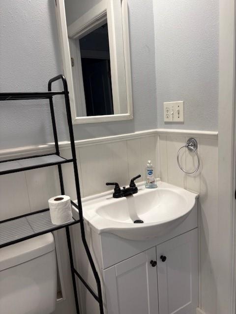 401 Reynolds Road Athens, TX 75751 - Photo 15 of 15 Bathroom vanity featuring a white ceramic sink, black fixtures, and a two-door cabinet with black hardware