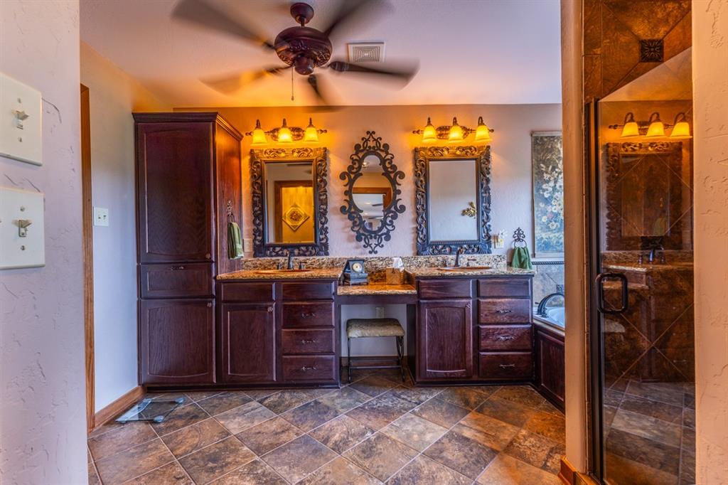 7060 Hells Gate Loop Strawn, TX 76475 - Photo 19 of 40 a view of living room kitchen with granite countertop furniture and a fireplace