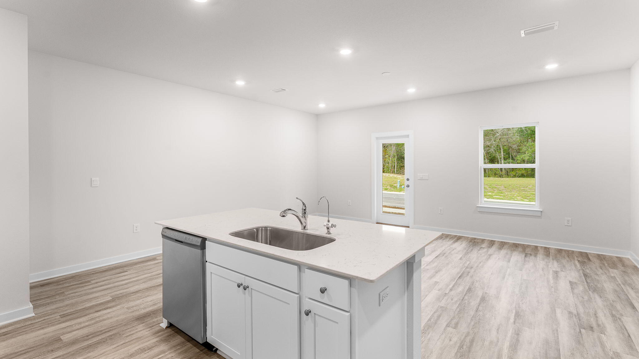 34 Rudder Lane Freeport, FL 32439 - Photo 14 of 32 a kitchen with a sink cabinets and wooden floor