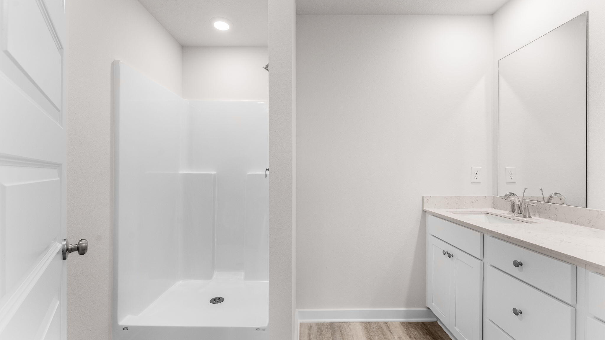 34 Rudder Lane Freeport, FL 32439 - Photo 21 of 32 a bathroom with a granite countertop sink a mirror and a shower