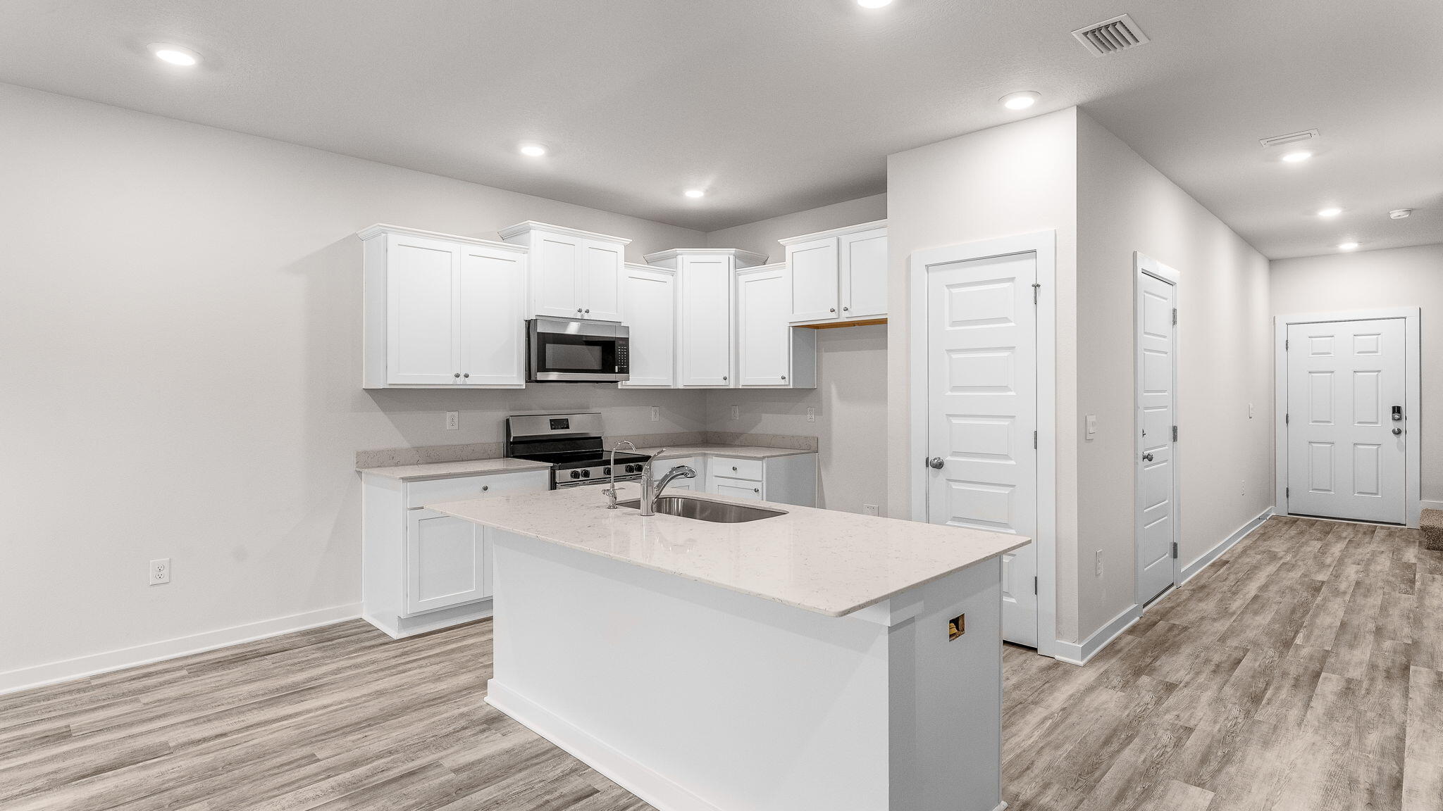34 Rudder Lane Freeport, FL 32439 - Photo 9 of 32 a kitchen with a sink a counter top space and cabinets