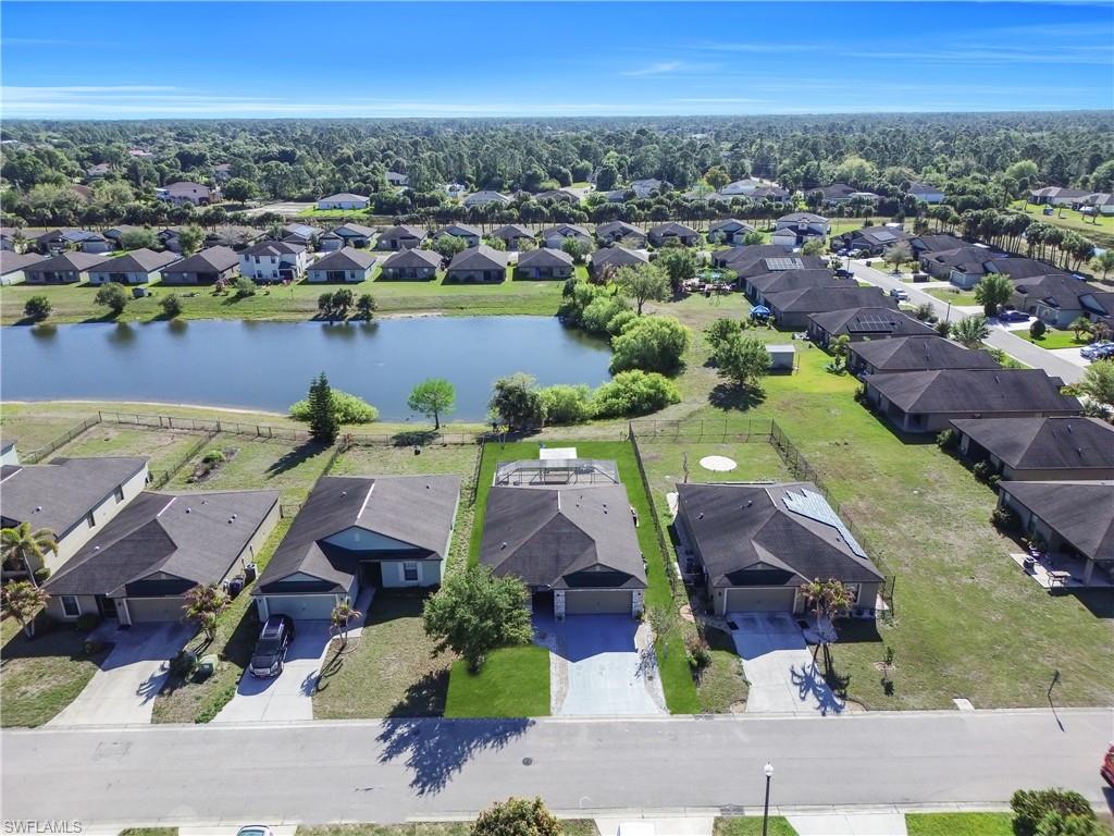 175 Shadowview Court Lehigh Acres, FL 33974 - Photo 35 of 39 an aerial view of residential houses with outdoor space