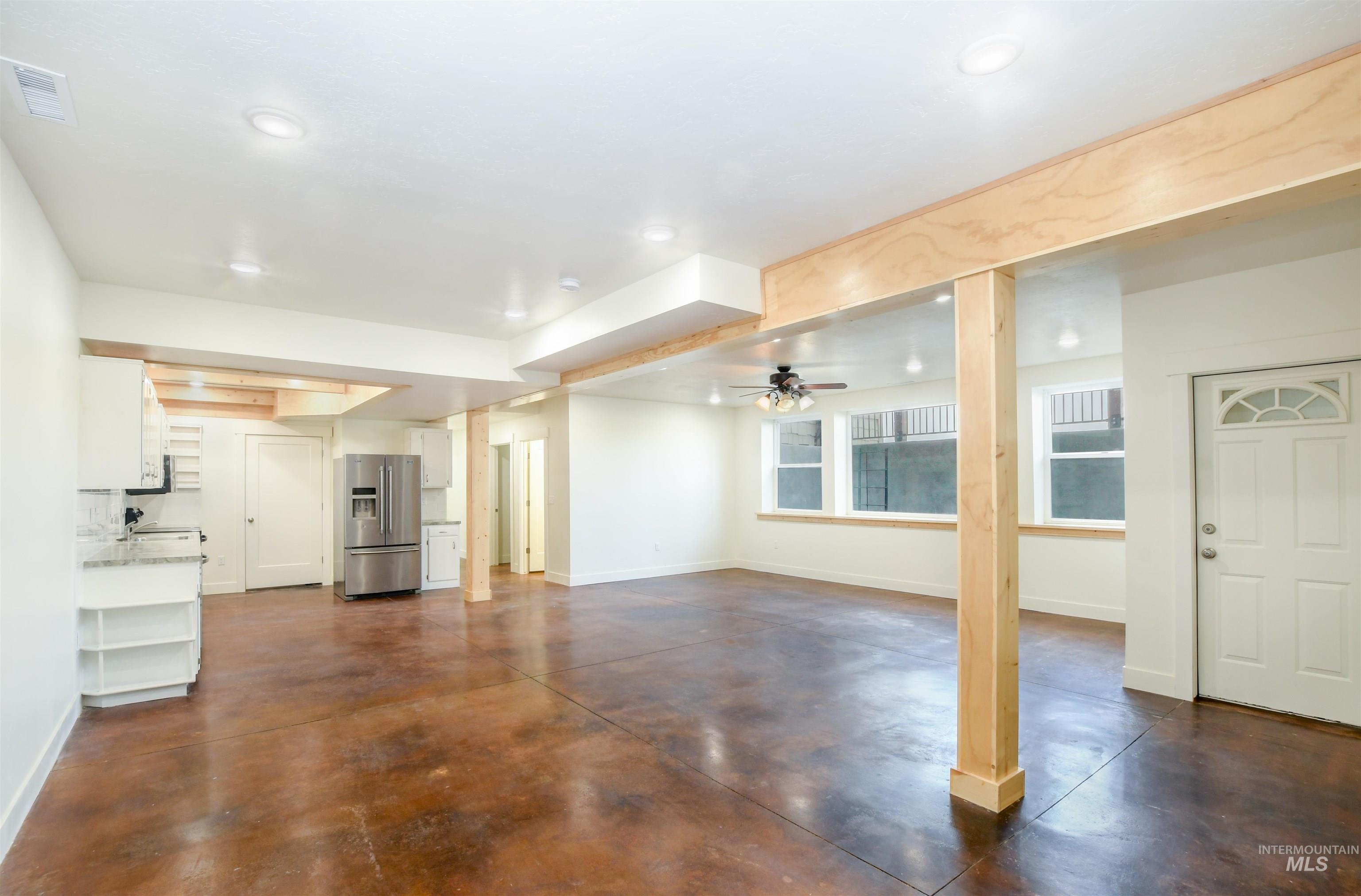 8481 Big Foot Road Melba, ID 83641 - Photo 19 of 41 Unfurnished living room featuring concrete floors and ceiling fan