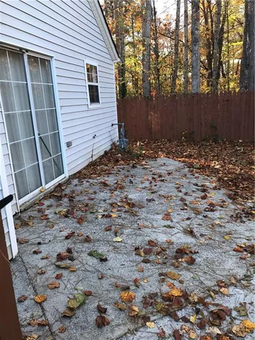 a view of a backyard of the house