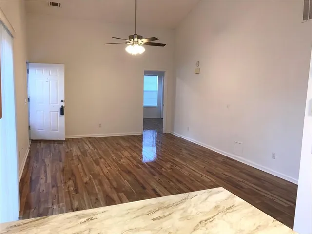 a view of a livingroom with wooden floor