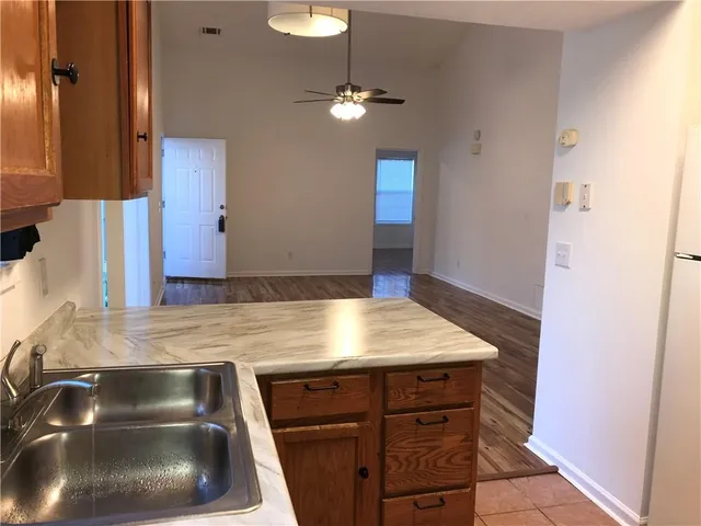 a kitchen with a sink and a stove