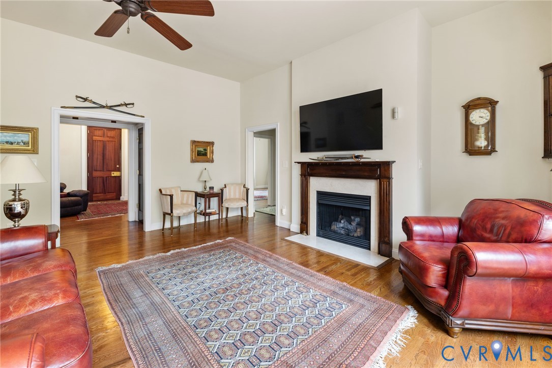 13173 Scotchtown Road Beaverdam, VA 23015 - Photo 20 of 65 a living room with furniture wooden floor and a fireplace