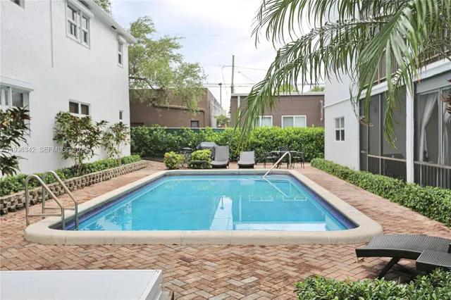 a view of a swimming pool with a patio