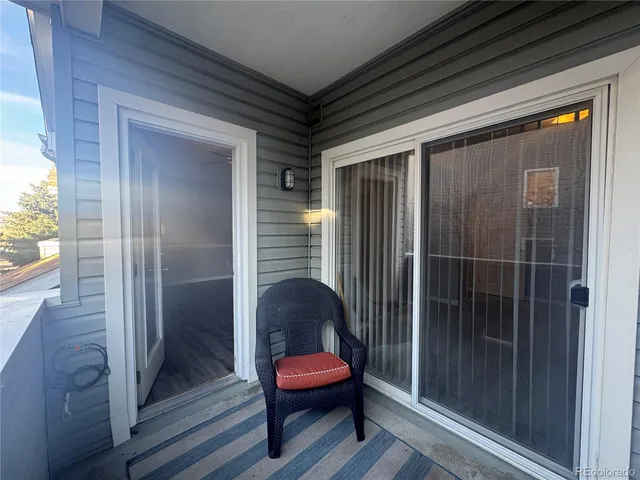 a view of a room with glass door and windows