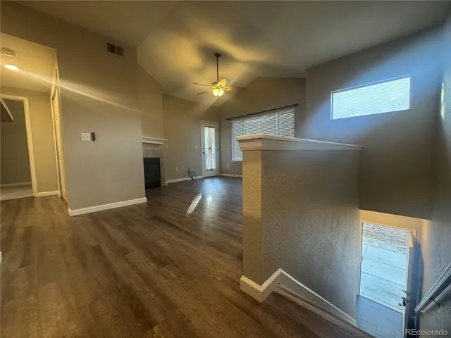 a view of livingroom with hardwood floor and hallway