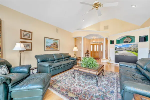a kitchen with granite countertop cabinets and window