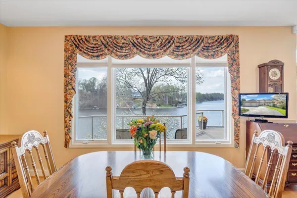 a view of a dining room with furniture window and outside view