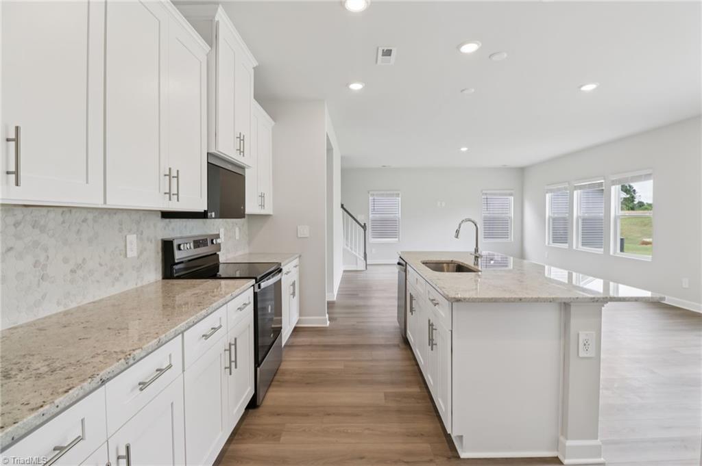 223 Nelson Crk Road Mocksville, NC 27028 - Photo 2 of 12 Photo is not of the actual home, but is an inspirational photo of builder’s model home and may depict options, furnishings, and/or decorator features that are not included