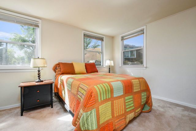 345 Olmsted Road Riverside, IL 60546 - Photo 15 of 31 a bedroom with a bed and window