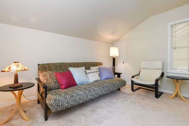 345 Olmsted Road Riverside, IL 60546 - Photo 17 of 31 a living room with furniture and a window