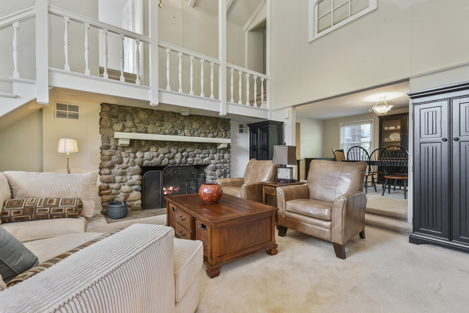 345 Olmsted Road Riverside, IL 60546 - Photo 7 of 31 a living room with furniture and a fireplace