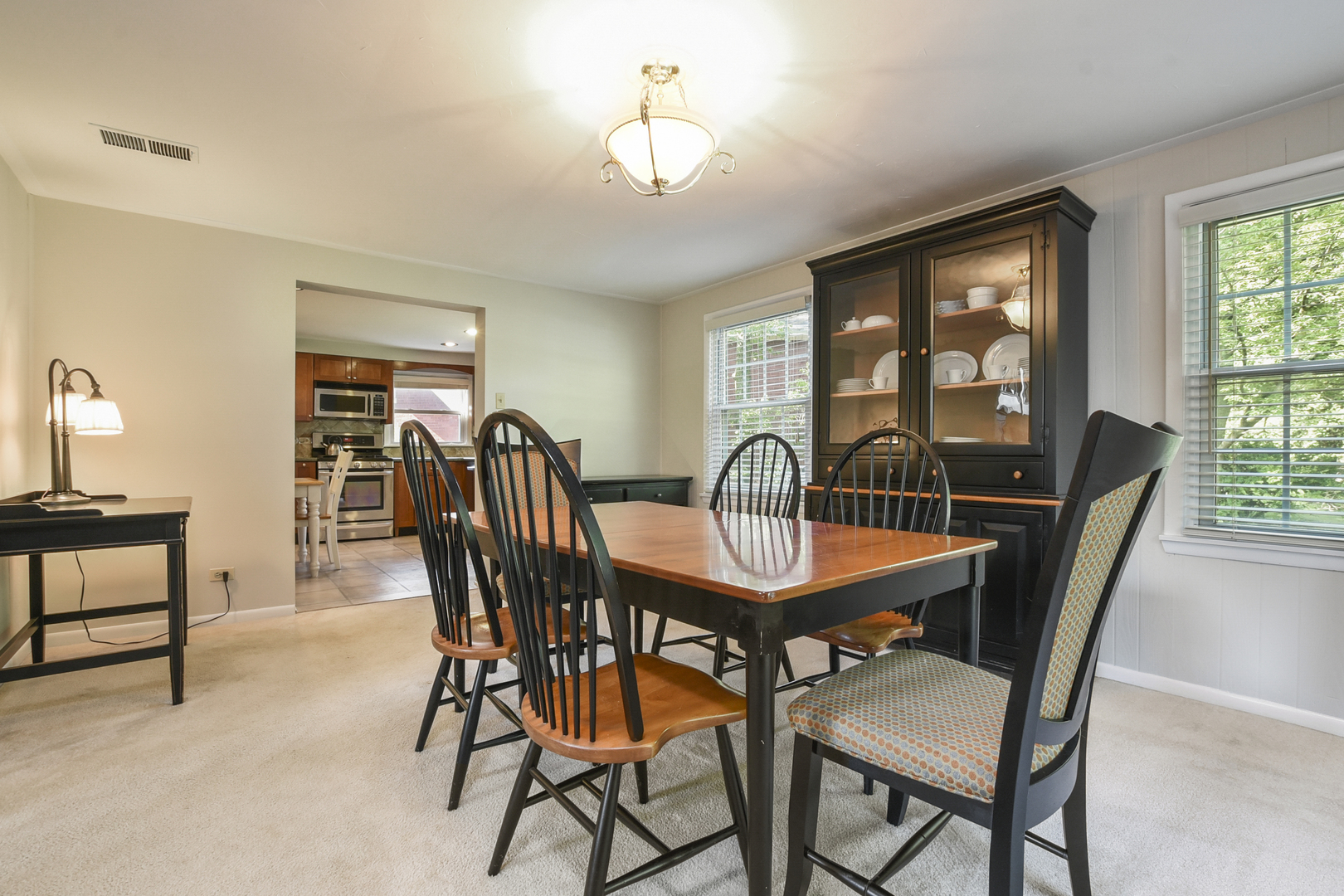 345 Olmsted Road Riverside, IL 60546 - Photo 8 of 31 a view of a dining room with furniture window and outside view