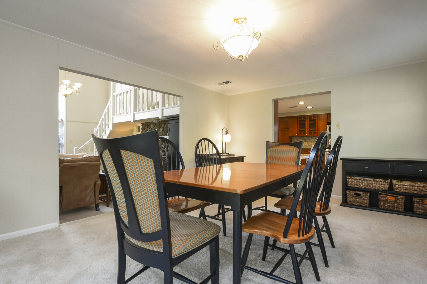 345 Olmsted Road Riverside, IL 60546 - Photo 9 of 31 a view of a dining room with furniture and a chandelier