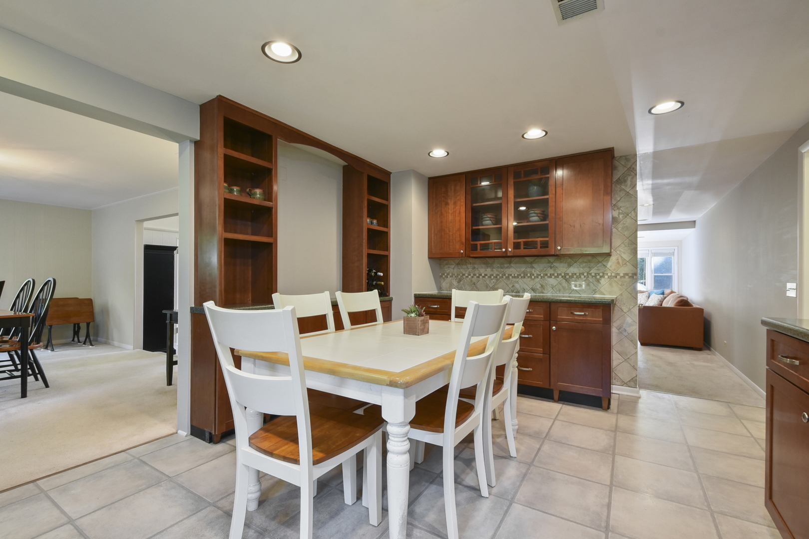345 Olmsted Road Riverside, IL 60546 - Photo 10 of 31 a view of a dining room that has a table and chairs in it