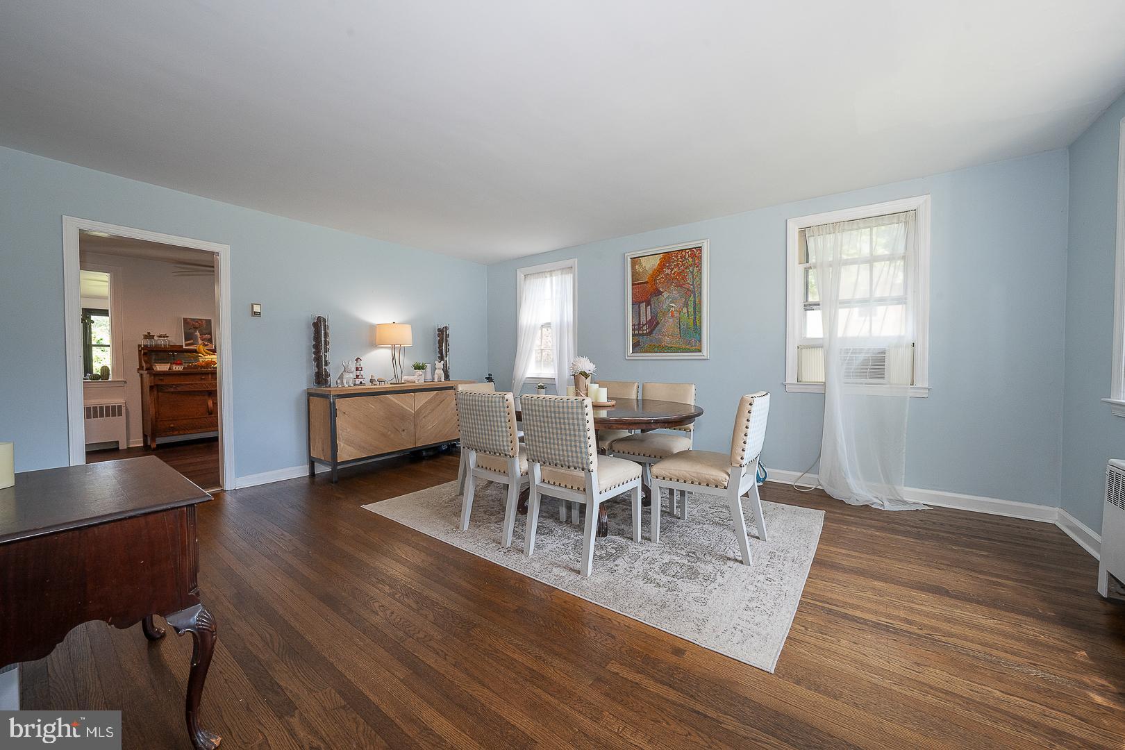 135 Sherman Road Springfield, PA 19064 - Photo 2 of 32 a dining room with furniture and wooden floor