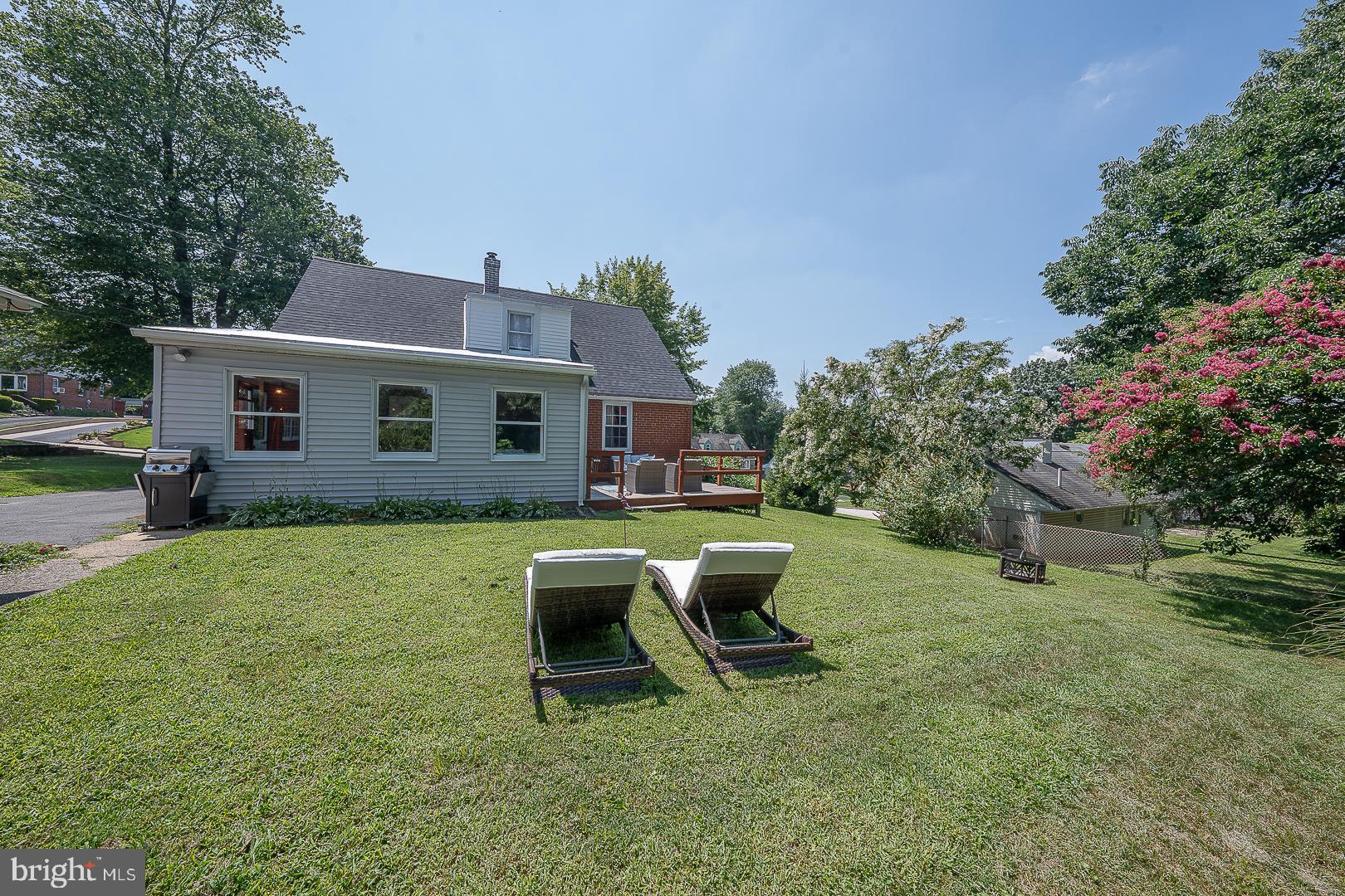 135 Sherman Road Springfield, PA 19064 - Photo 31 of 32 a view of a house with backyard sitting area and garden