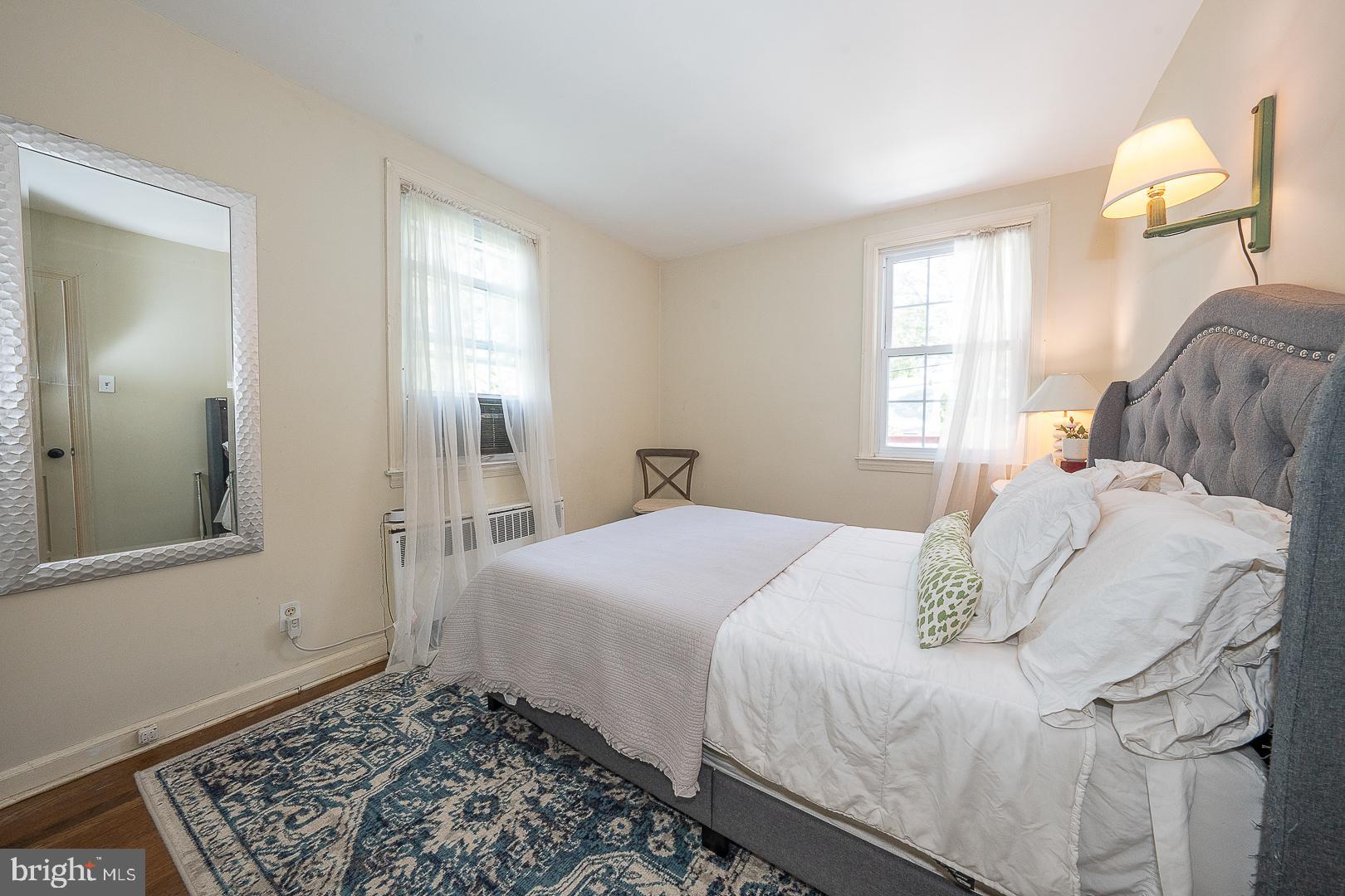 135 Sherman Road Springfield, PA 19064 - Photo 8 of 32 a bedroom with a bed and a window