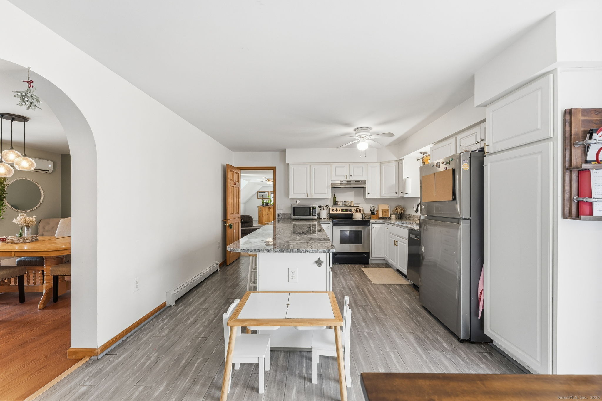 87 South Brook Road Hampton, CT 06247 - Photo 14 of 35 a living room with stainless steel appliances furniture wooden floor and a view of kitchen