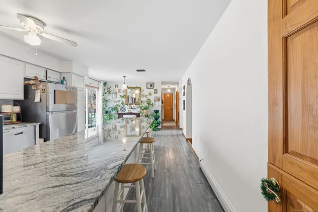 a view of a kitchen from the hallway