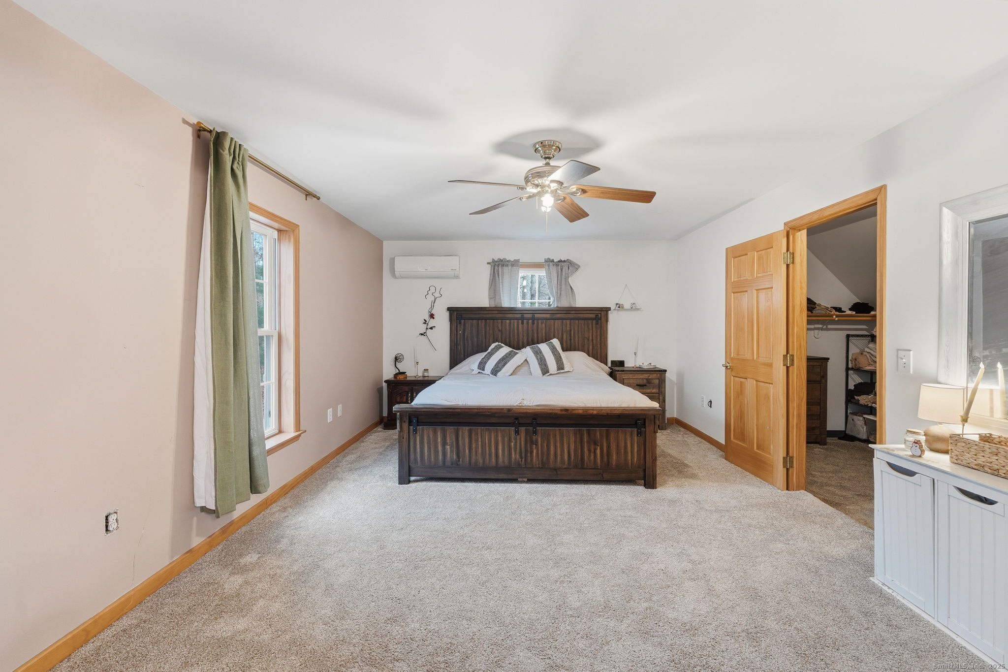 87 South Brook Road Hampton, CT 06247 - Photo 17 of 35 a spacious bedroom with a bed and a chandelier