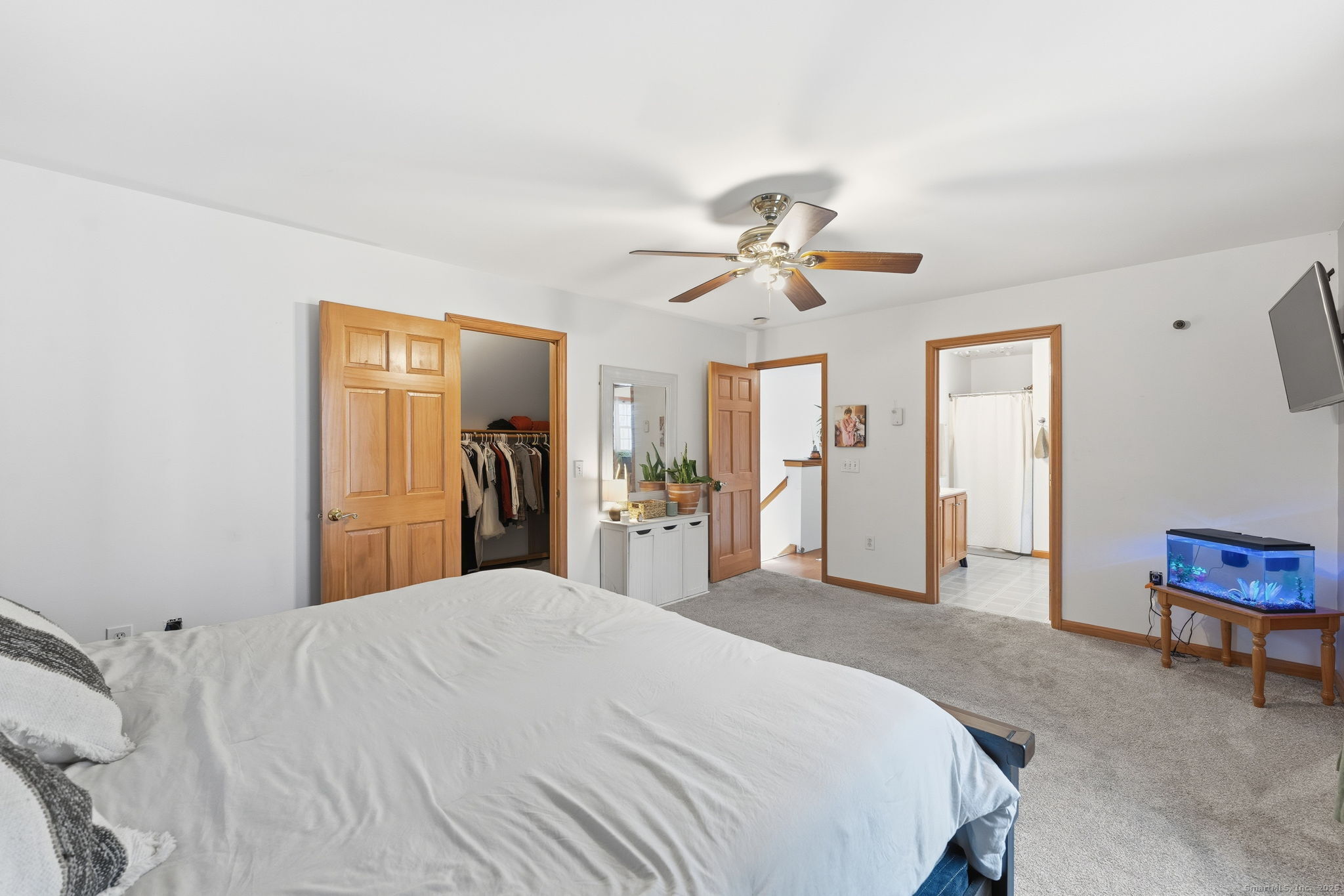 87 South Brook Road Hampton, CT 06247 - Photo 18 of 35 a bedroom with a large bed a chandelier and dresser