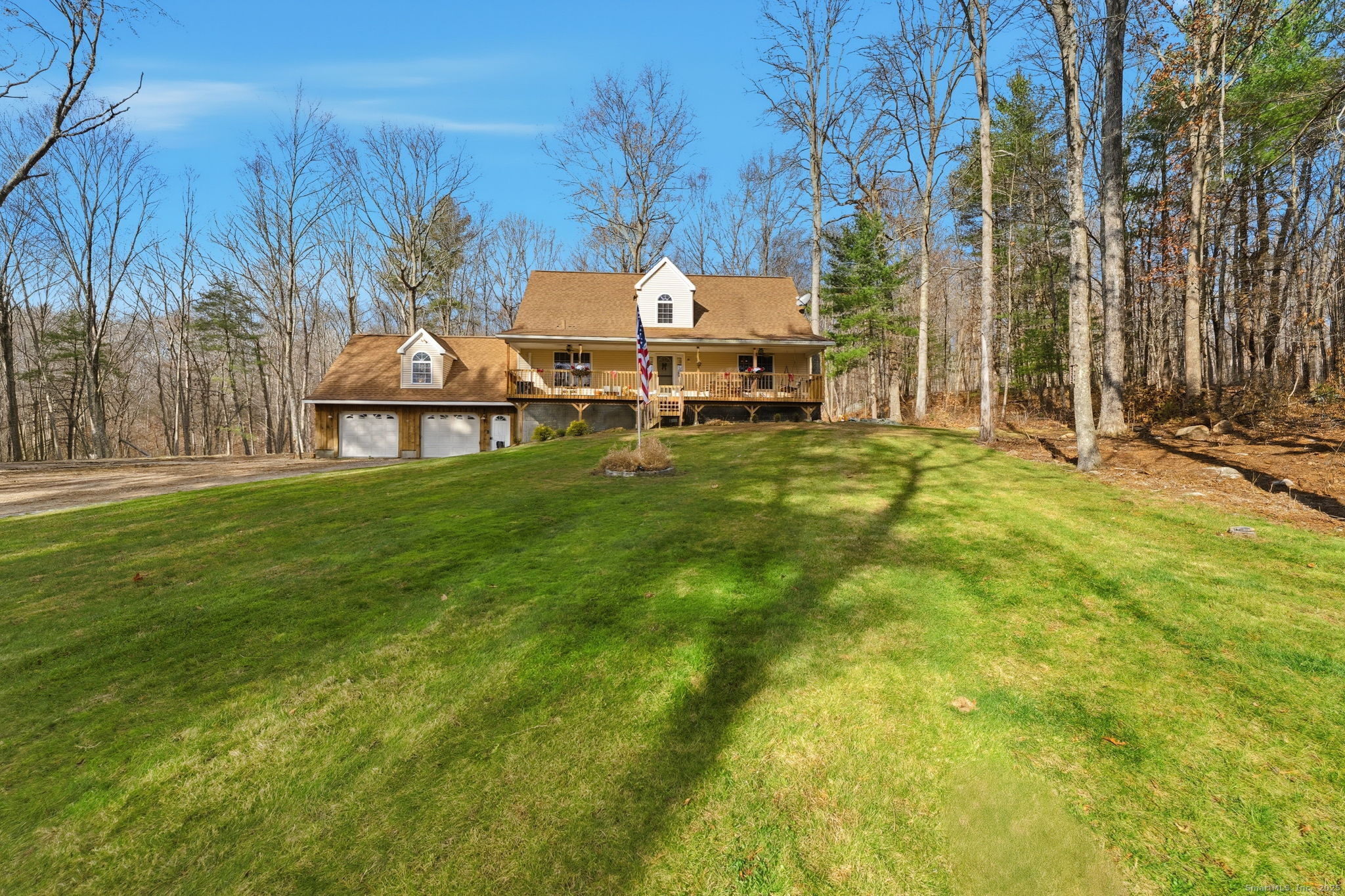 87 South Brook Road Hampton, CT 06247 - Photo 2 of 35 a backyard of a house with table and chairs