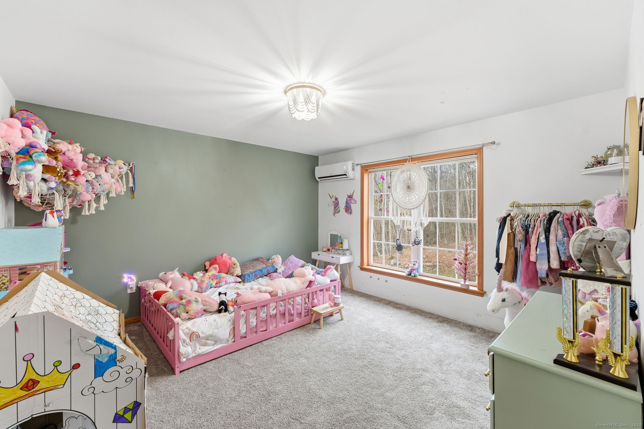 87 South Brook Road Hampton, CT 06247 - Photo 22 of 35 a bedroom with furniture and a chandelier