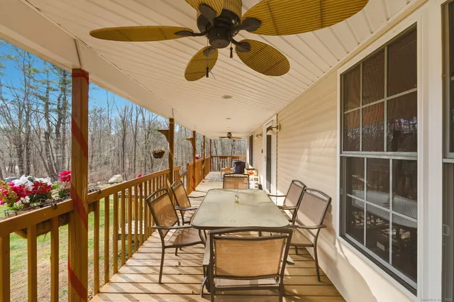 a view of a balcony and dining area