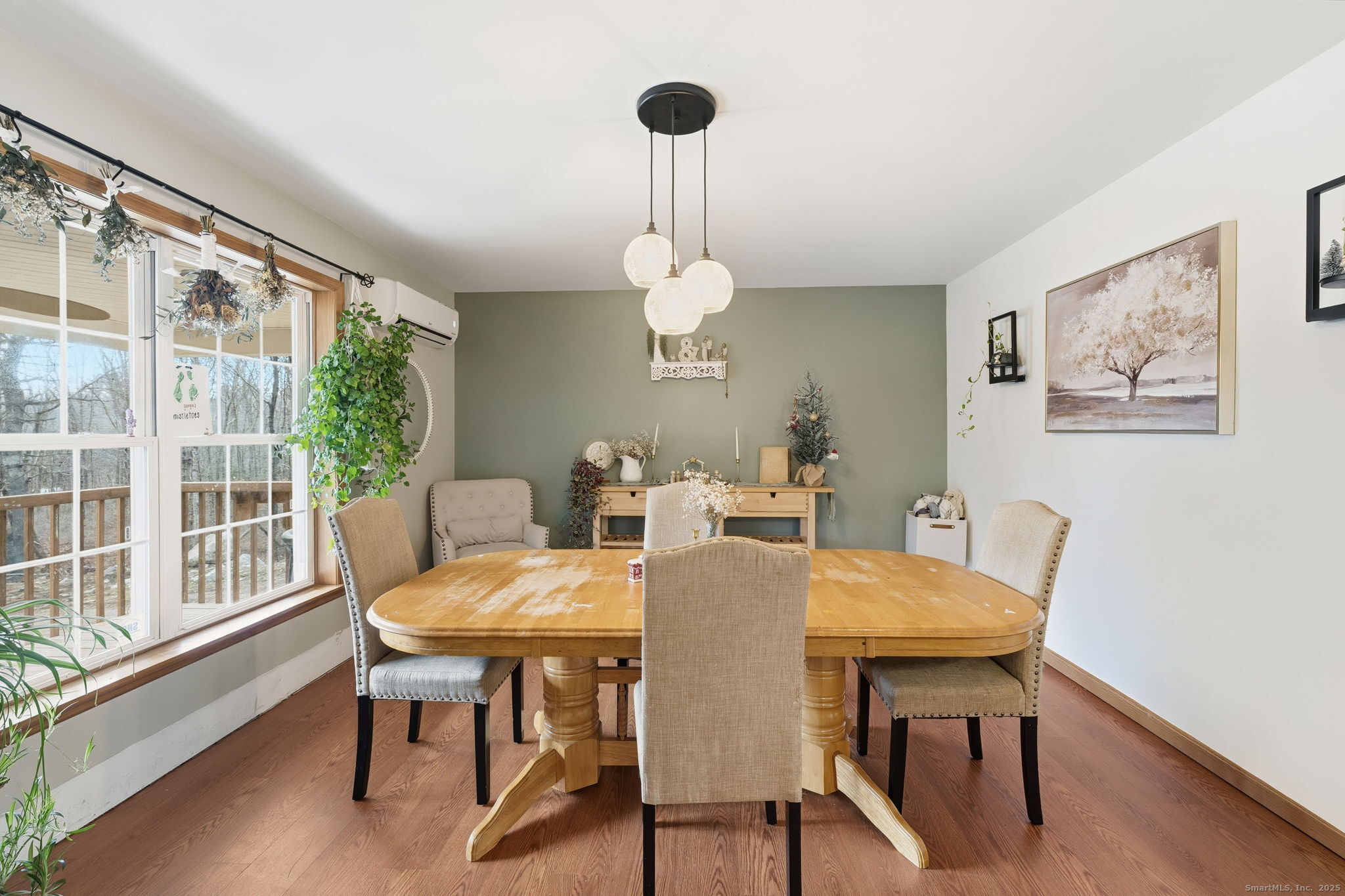 87 South Brook Road Hampton, CT 06247 - Photo 10 of 35 a view of a dining room with furniture wooden floor and a chandelier