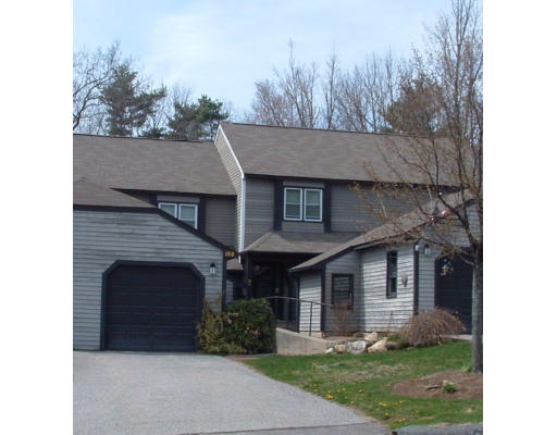 19 Highfield Road, Unit B Charlton, MA 01507 - Photo 1 of 28 a front view of a house with garden