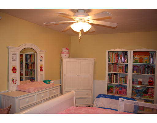 19 Highfield Road, Unit B Charlton, MA 01507 - Photo 11 of 28 a living room with furniture and a bookshelf