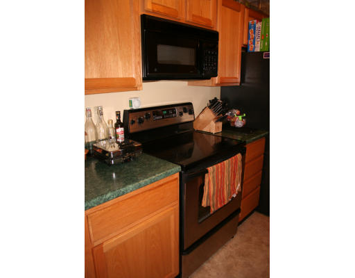 19 Highfield Road, Unit B Charlton, MA 01507 - Photo 24 of 28 a kitchen view of a house and a stove
