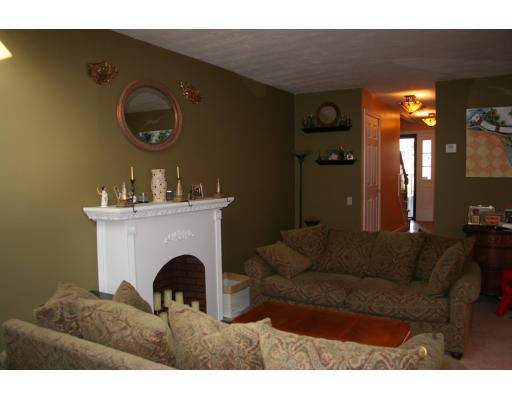 19 Highfield Road, Unit B Charlton, MA 01507 - Photo 4 of 28 a living room with furniture and a fireplace