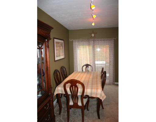 19 Highfield Road, Unit B Charlton, MA 01507 - Photo 6 of 28 a view of a dining room with furniture and chandelier