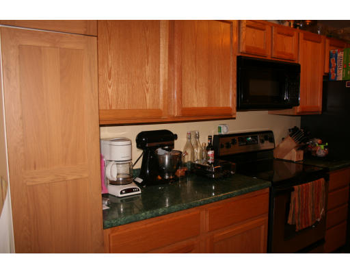 19 Highfield Road, Unit B Charlton, MA 01507 - Photo 9 of 28 a kitchen with a sink and cabinets