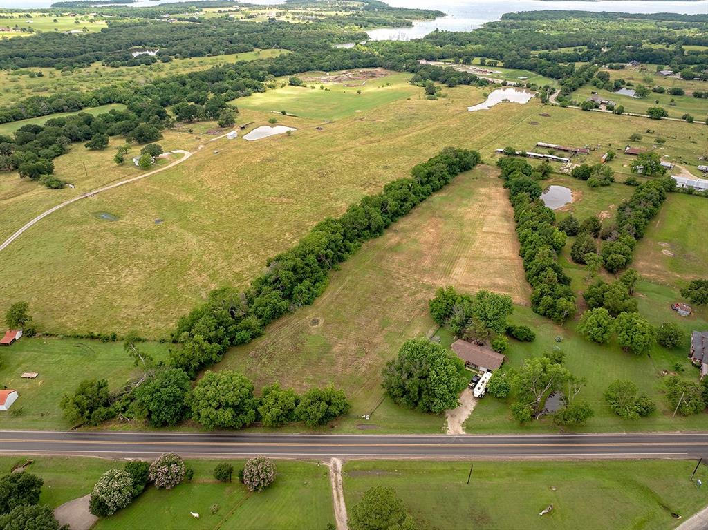 0 North Washington Street Pilot Point, TX 76258 - Photo 2 of 14 an aerial view of ocean with residential house and outdoor space