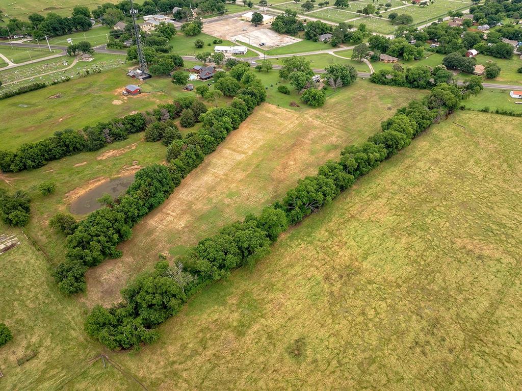 0 North Washington Street Pilot Point, TX 76258 - Photo 6 of 14 a view of a street with a yard